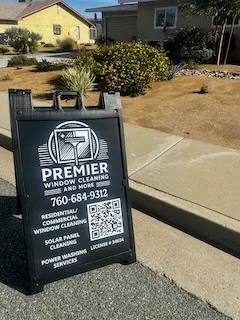 Premier Window Cleaning sign outside a residential property